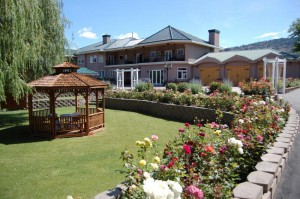 Silver Sage Winery's beautiful gardens and wooden gazebo on a sunny day.