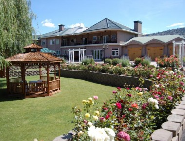 Silver Sage Winery's beautiful gardens and wooden gazebo on a sunny day.