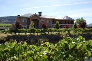 Outside of the Silver Sage Winery's building with beautiful gardens, vineyards and landscaping on a sunny day.
